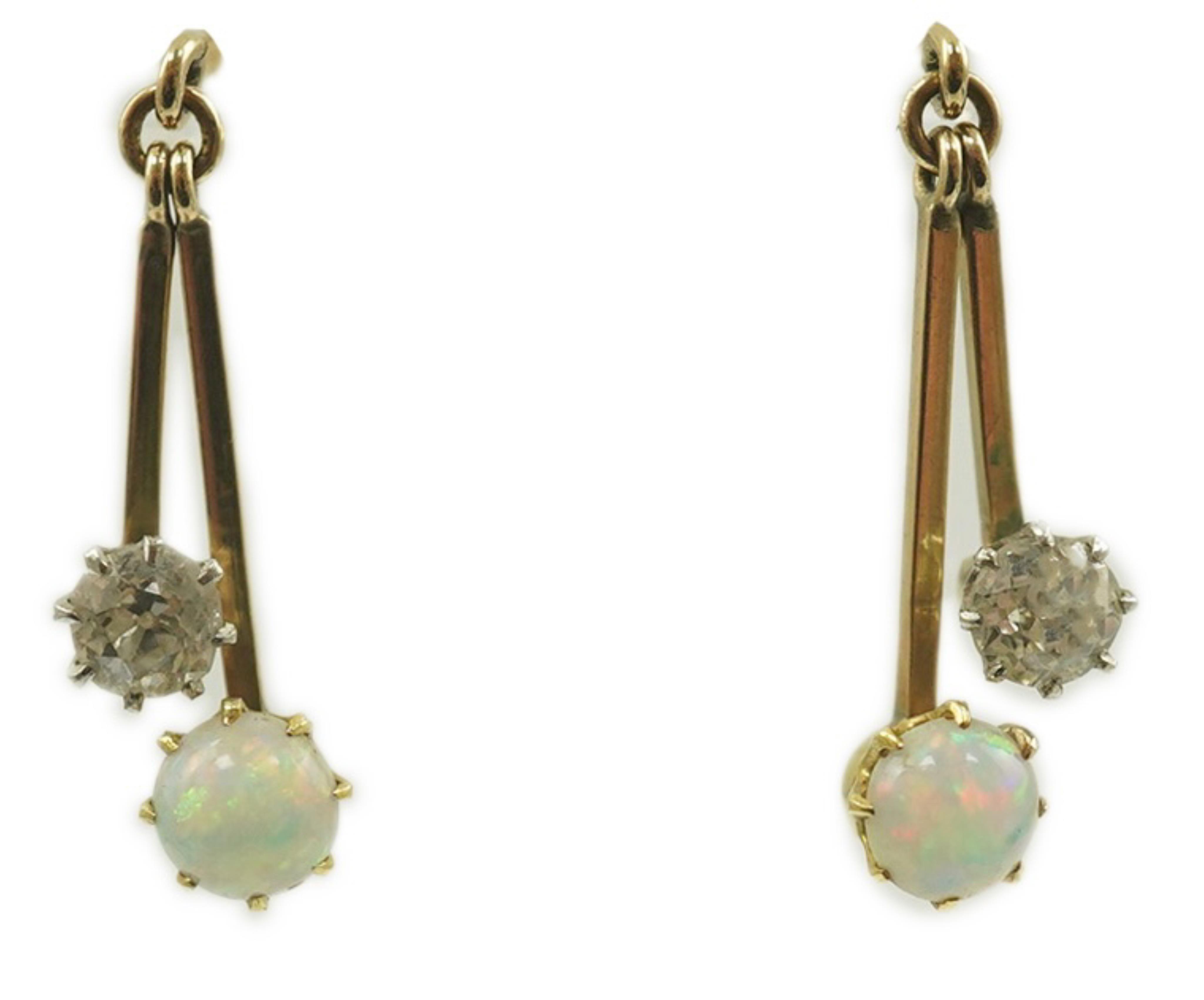 A pair of 9ct gold, white opal and diamond set double drop earrings